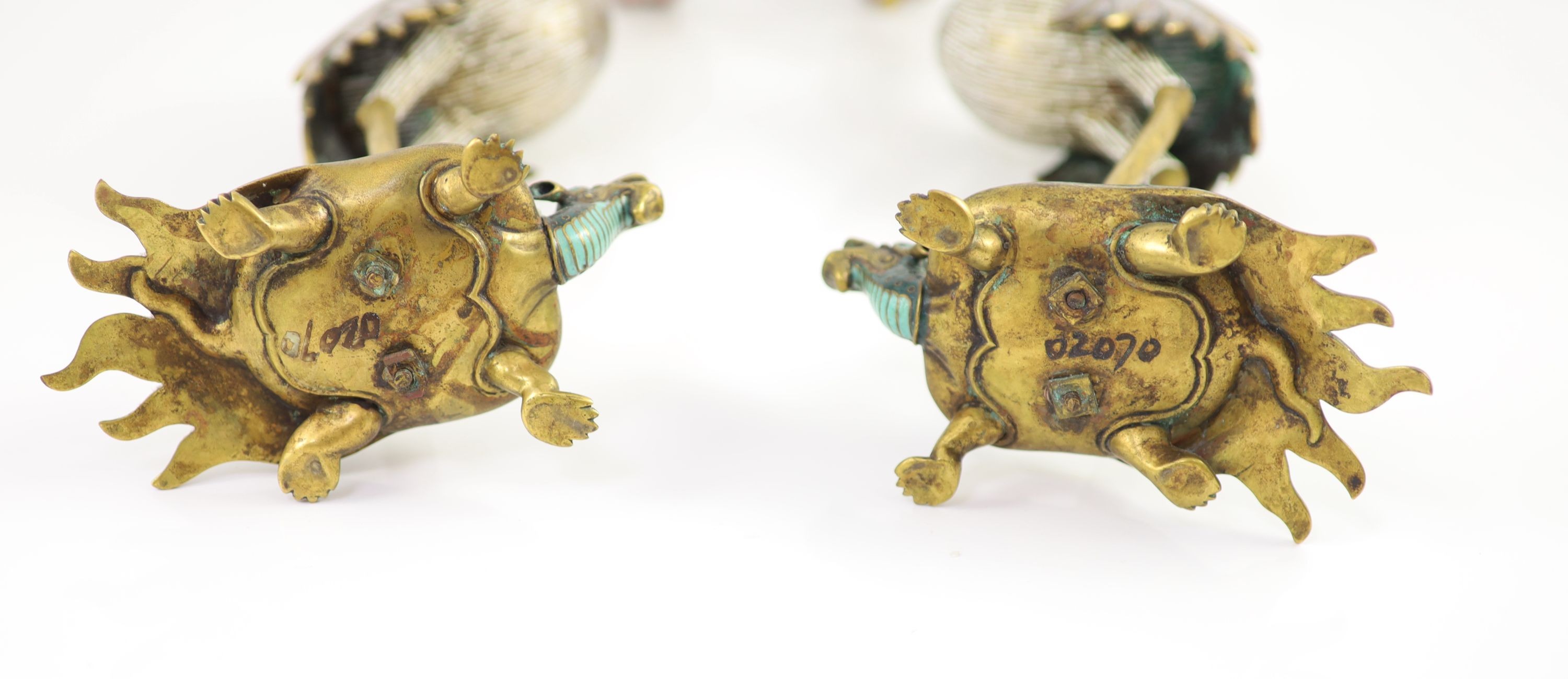 A pair of Chinese cloisonné enamel and gilt bronze ’crane’ candlesticks, early 20th century, 38cm high